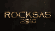 the word rocksas is written in gold on a dark background