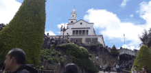 a white building with a cross on the top of it