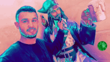 a man is standing next to a pirate statue