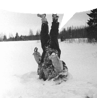 a person laying upside down in the snow