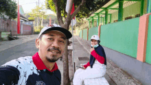 a man and a woman are posing for a picture while sitting on a bench