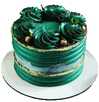 a green and gold cake with leaves on top