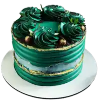 a green and gold cake with leaves on top