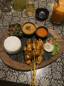 a plate of food on a table with rice and sauce