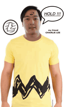 a man wearing a yellow charlie lee t-shirt