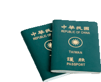 two green passports from the republic of china are stacked on top of each other