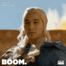 a picture of a man with blonde hair and the word boom on it