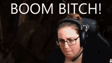 a woman wearing glasses and headphones is making a funny face and says boom bitch .