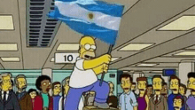 homer simpson is holding a flag in front of a crowd of people in an airport .