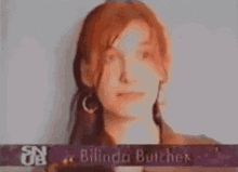 a close up of a woman 's face with the name bilinda butcher on the bottom