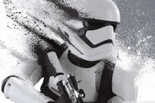 a storm trooper holding a gun with a splash of paint behind him