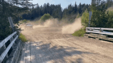 a dirt road with a sign that says ' no parking ' on it