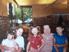 a family poses for a photo in a library