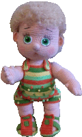 a crocheted doll with green eyes is wearing a striped outfit