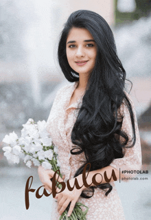 a woman with long black hair is holding a bouquet of white flowers in front of a sign that says " fabulous "