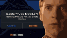 a man looking at a screen that says " delete pubg mobile "