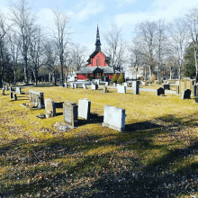 a cemetery with a church in the background