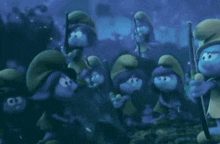 a group of smurfs are standing next to each other in a dark forest holding sticks .