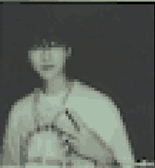 a pixelated image of a person 's face with a black background