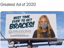 a billboard for smile at the world orthodontics with a girl wearing a mask