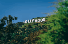 the hollywood sign is on top of a hill