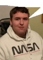 a man is wearing a nasa sweatshirt and looking at the camera