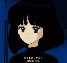 a girl with black hair is smiling and says thank you in japanese