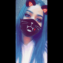 a girl with blue hair wearing a cat mask