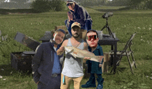 a group of people posing for a picture with a man holding a large fish