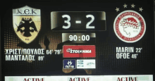 a scoreboard for a soccer game shows a score of 3-2