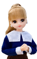 a doll wearing a blue shirt with a white collar and rhinestones on it