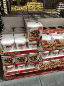 several boxes of nutella are on a shelf in a store