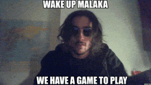 a man wearing sunglasses says wake up malaka