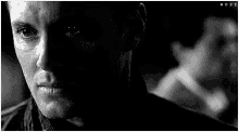 a close up of a man 's face in a black and white photo with the word hoshi on the bottom