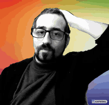 a man wearing glasses holds his hand to his forehead in front of a colorful background that says kapwing on the bottom