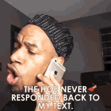 a man wearing a hat is talking on a cell phone and says `` the hoe never responded back to my text '' .