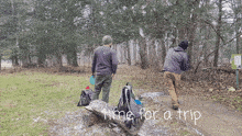 two men are playing frisbee golf in the snow and the words time for a trip are on the bottom