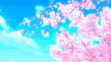 a cherry blossom tree against a blue sky with clouds