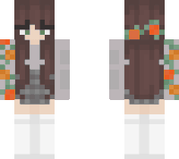 a girl with brown hair and green eyes is wearing a minecraft skin with a flower in her hair .