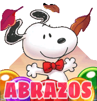 a cartoon of snoopy wearing a red bow tie is surrounded by colorful candy and the words abrazos