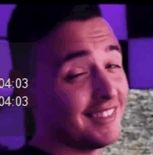 a close up of a man 's face with the time 4:03