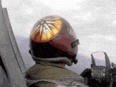 a pilot wearing a helmet that says kal