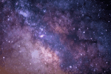 a purple and pink galaxy with many stars in it