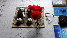 a table with a tea set and a book that says ' a ' on the cover