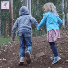 a boy and a girl are running down a dirt path with a sign that says always in the background