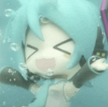 a doll with blue hair and headphones is floating in the water with bubbles coming out of her mouth