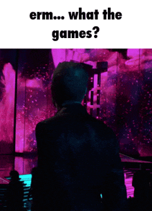 a man in a suit is standing in front of a purple background with the words " what the games "