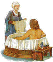 a woman is standing next to a man taking a bath in a wooden tub .