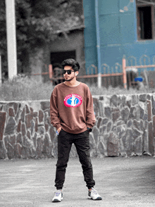 a young man wearing sunglasses and a sweatshirt that says dirty to good