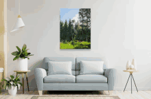 a living room with a blue couch and a painting on the wall